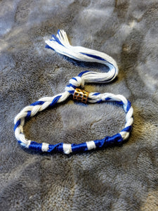 Royal blue and white "tzitlette" with slide-locking bead